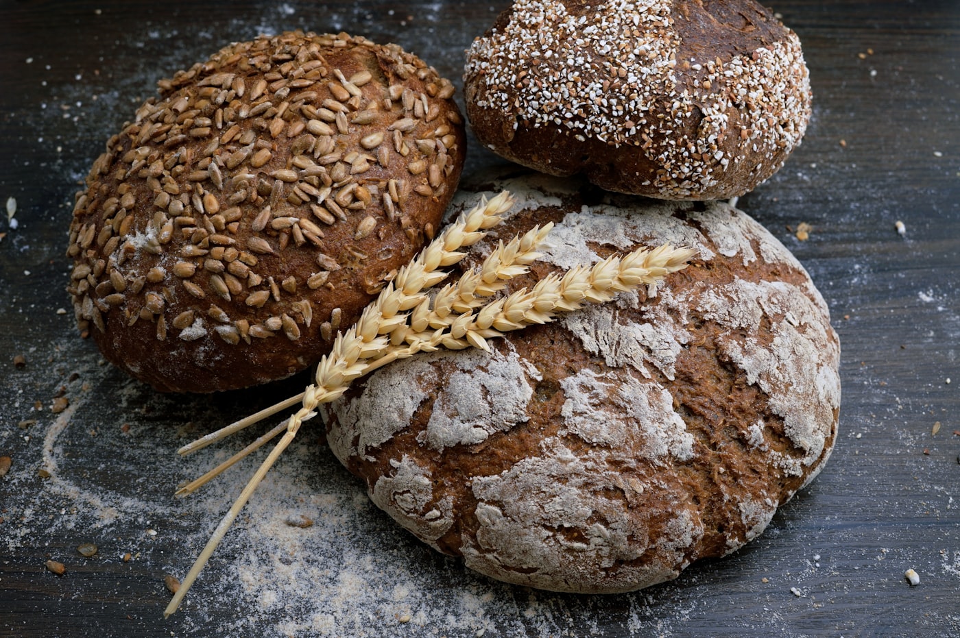 cinematic artisan bakery counter with chocolate croissants, beige ceramic cups, soft window light, no woman